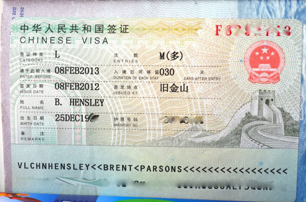 A Chinese visa sewn into a passport | The People are the Heroes Now