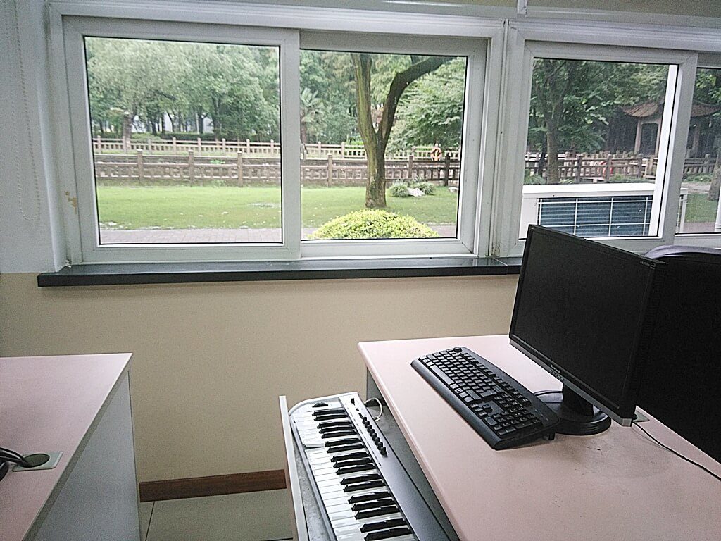 A close-up of a keyboard and very old computer at my international Chinese school | The People are the Heroes